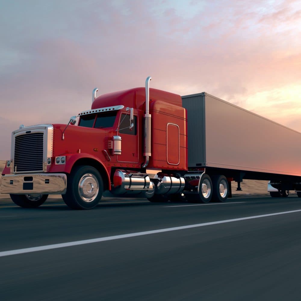 Red semi truck on the road